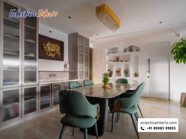 "Cozy dining nook with a round table, cushioned chairs, and a vase of fresh flowers."